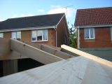 Lengths of flat edged pine used for roof